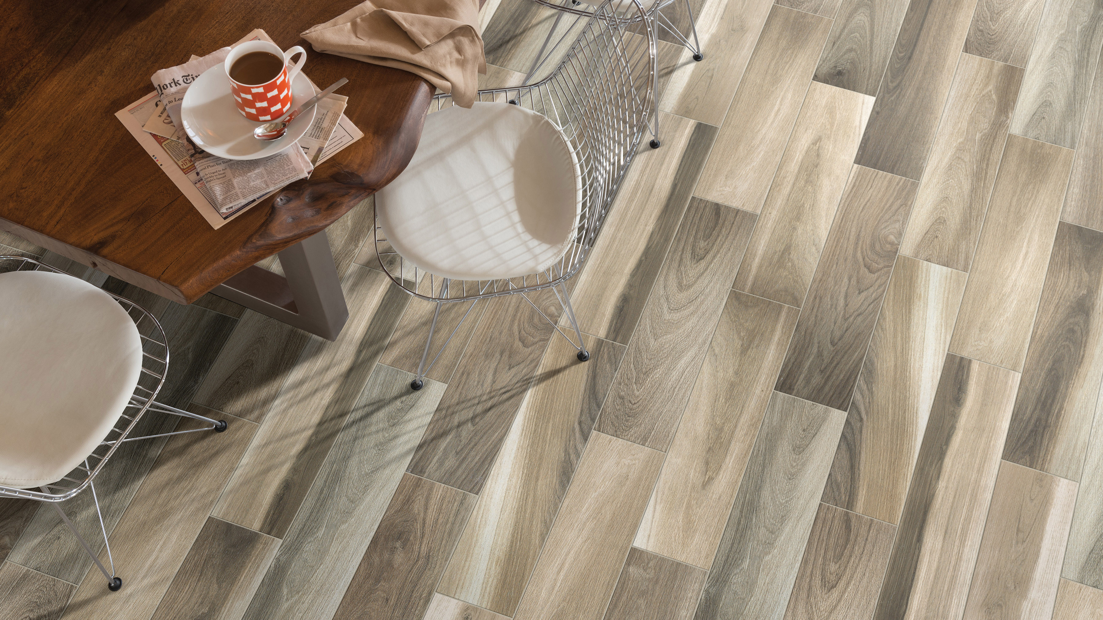 Wood-look tile flooring in a dining area, installation services available.