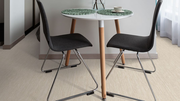 commercial flooring photo, 2 black chairs, white counterops